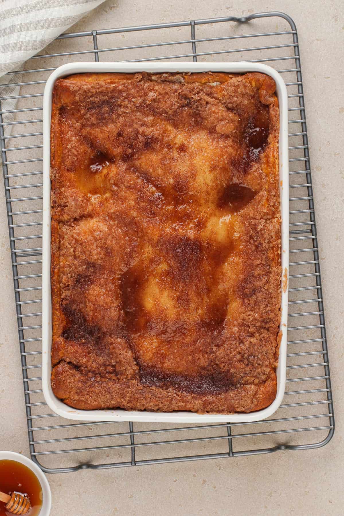 Baked sopapilla cheesecake cooling on a wire rack.