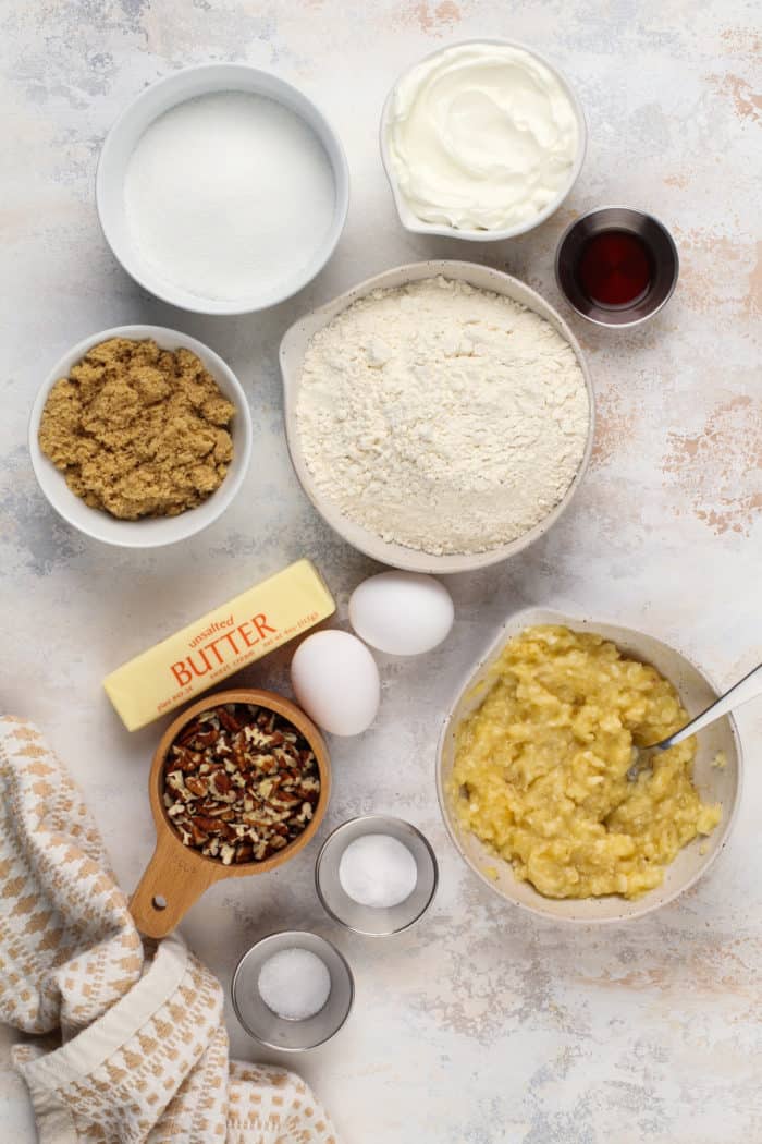 Banana bar ingredients arranged on a light-colored countertop.