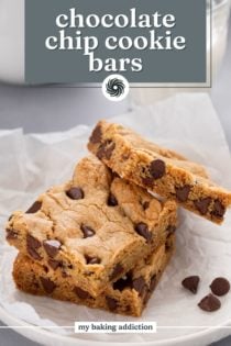 Stack of chocolate chip cookie bars on a piece of parchment paper. Text overlay includes recipe name.