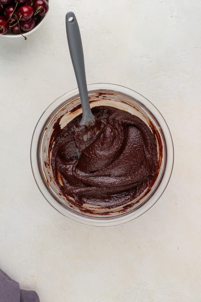 Chocolate ganache in a glass bowl.