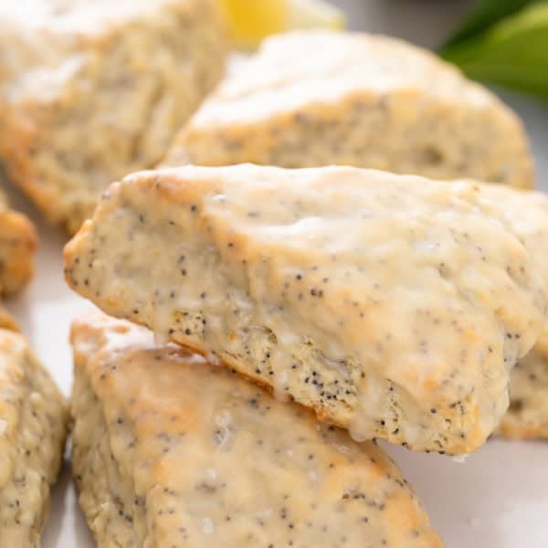 Close up of glazed lemon poppy seed scones.