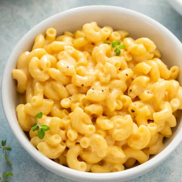 Close up of a white bowl filled with one pot mac and cheese