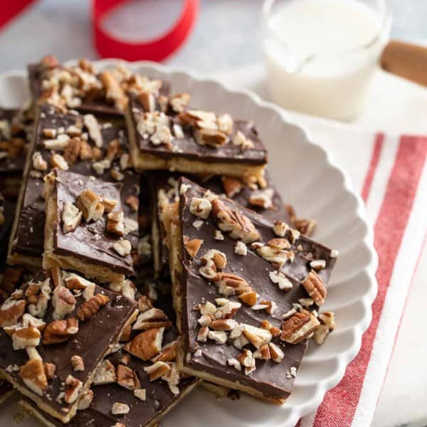 Saltine toffee stacked on a white platter