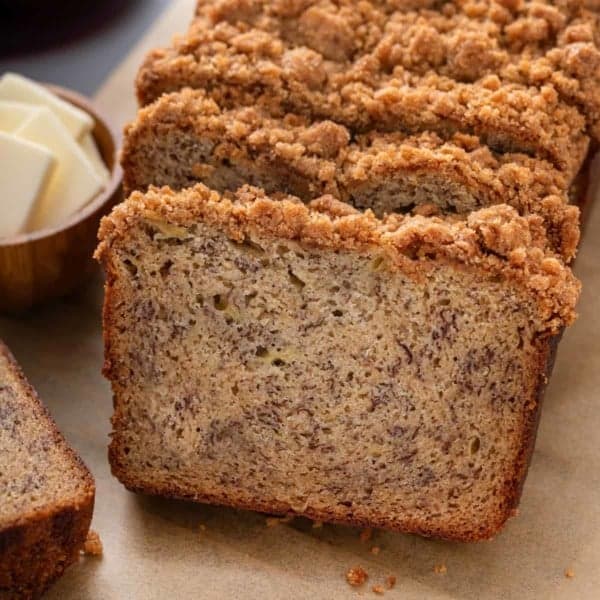 Slices of streusel-topped brown butter banana bread.