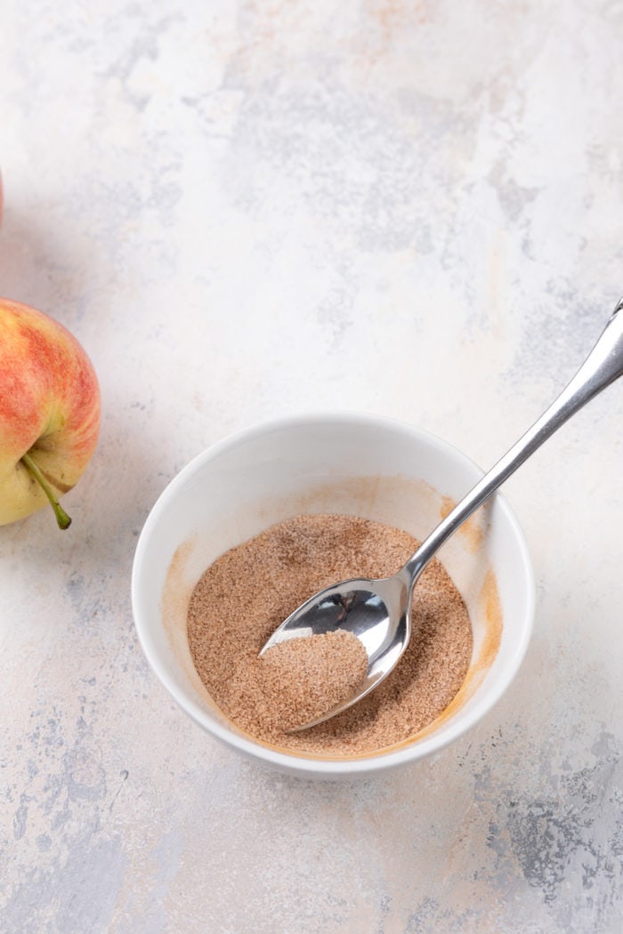 Spiced sugar mixture in a small white bowl.